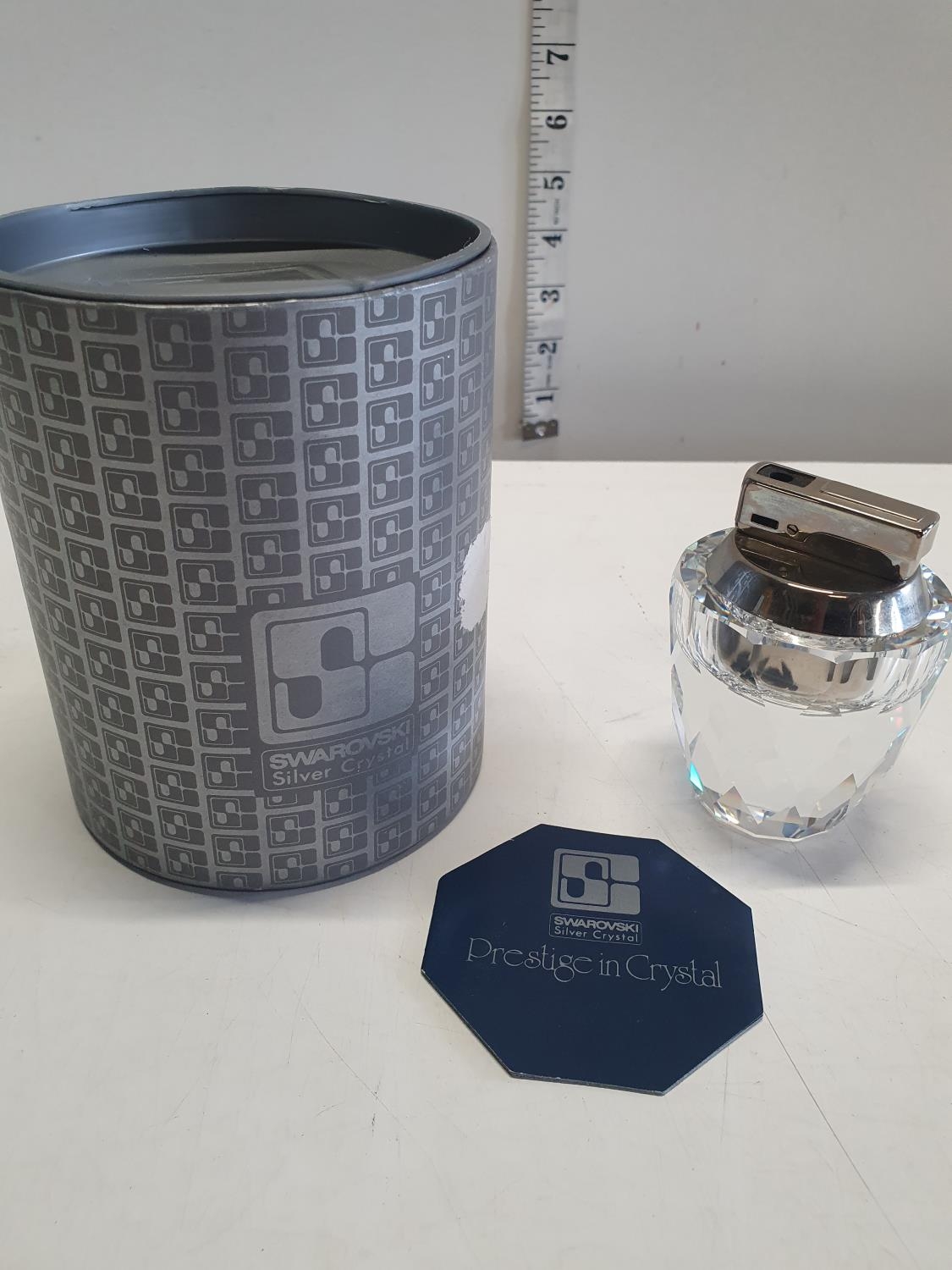 A boxed Swarovski table lighter