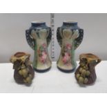Two pairs of hand painted ceramic vases.Shipping unavailable