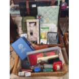 Two baskets of new items including kitchenalia and stationery, shipping unavailable