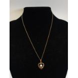 A 9ct Gold chain and pendant. 1.83g