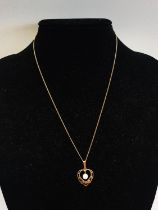 A 9ct Gold chain and pendant. 1.83g