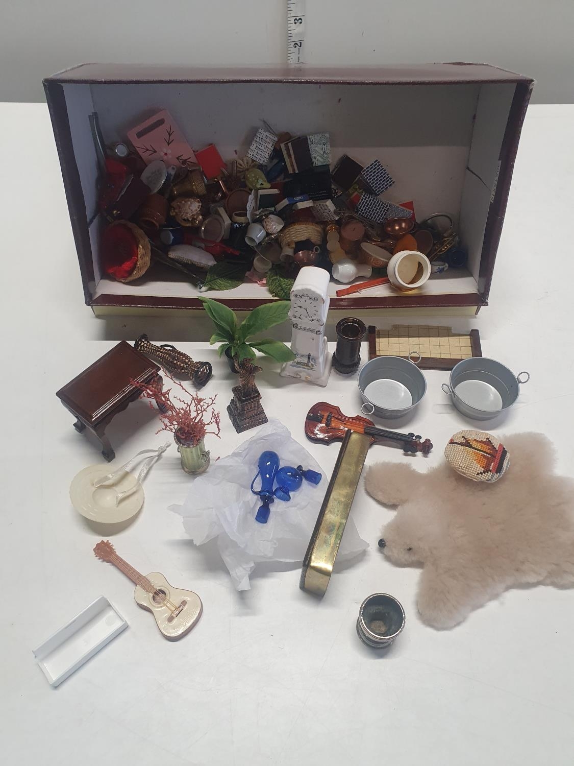 A selection of vintage dolls house accessories