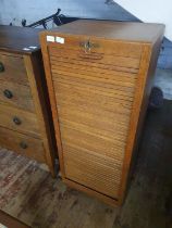 An antique oak roll front Tambour cabinet with key, lock in working order. 115x48x38, shipping