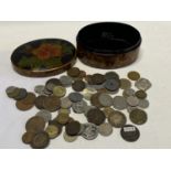 A papier mache box and contents of old world and British coins etc