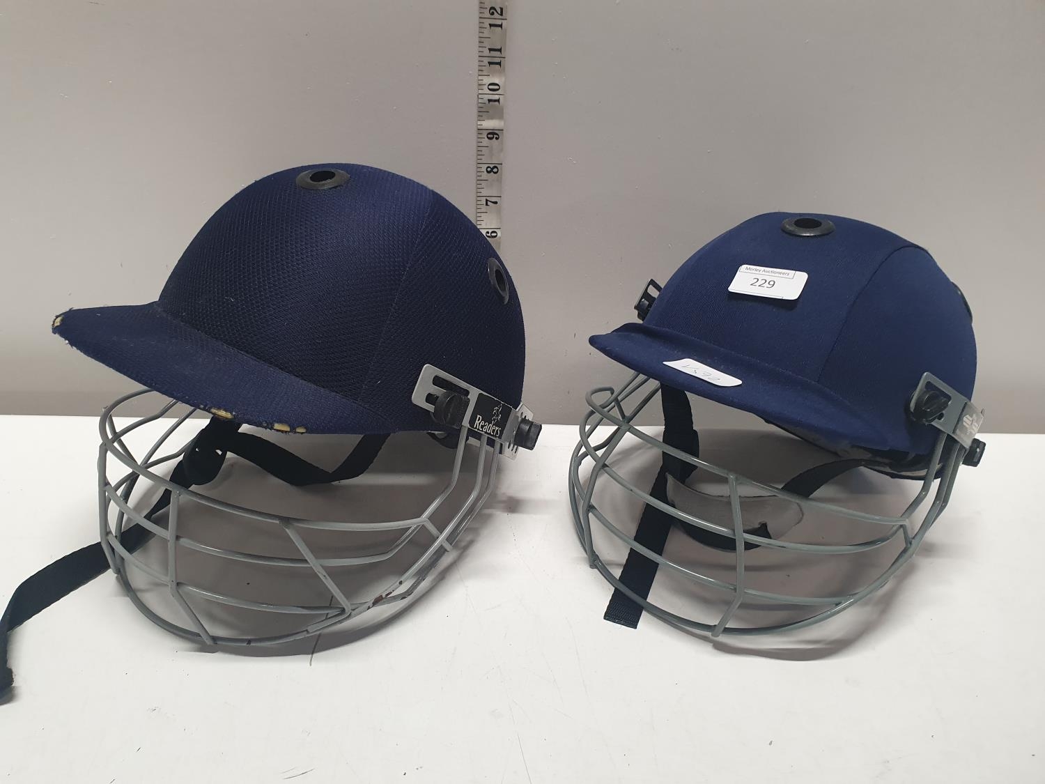 Two cricket helmets, shipping unavailable