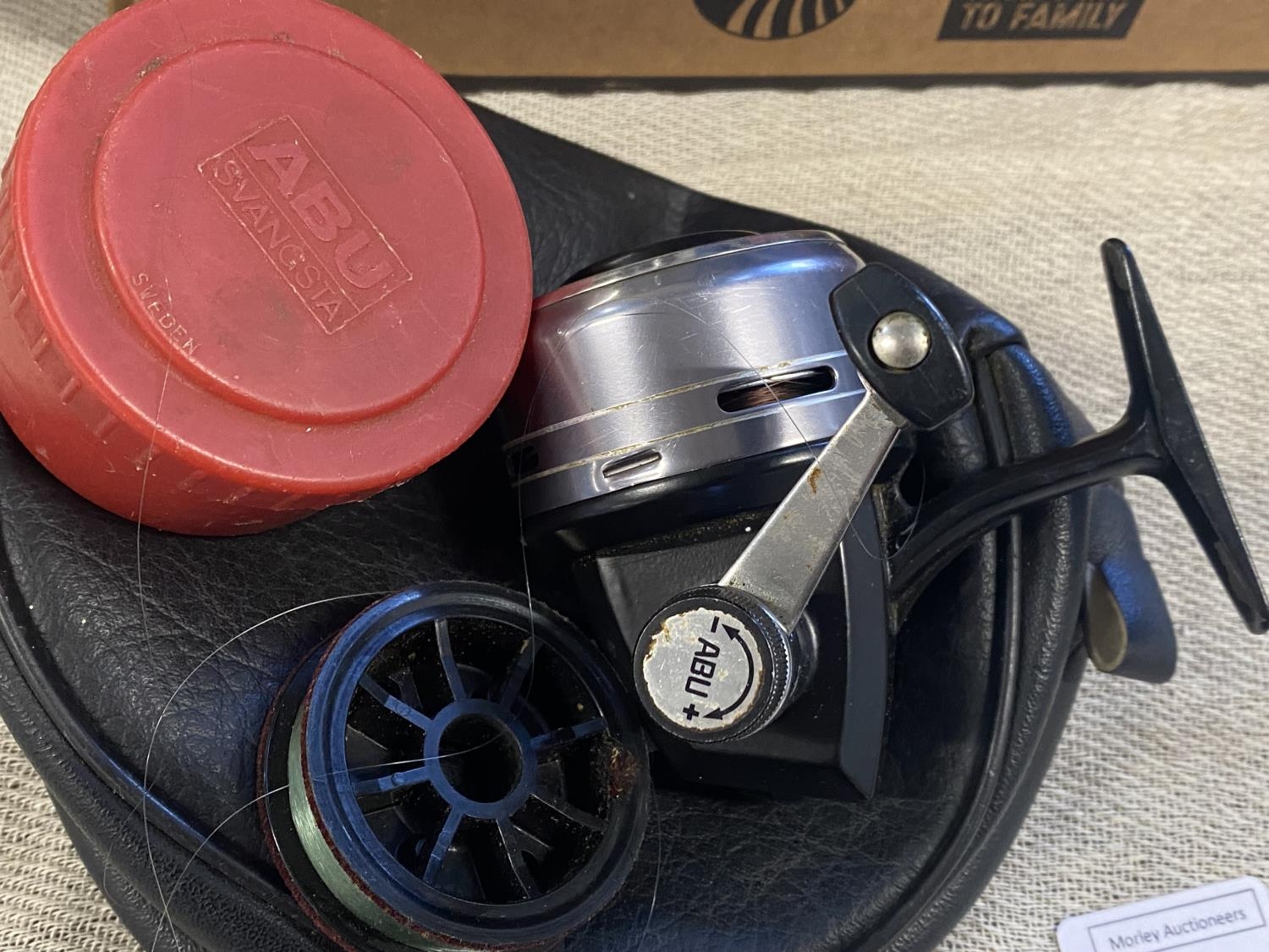 A vintage Abu 506M fishing reel with spare spool