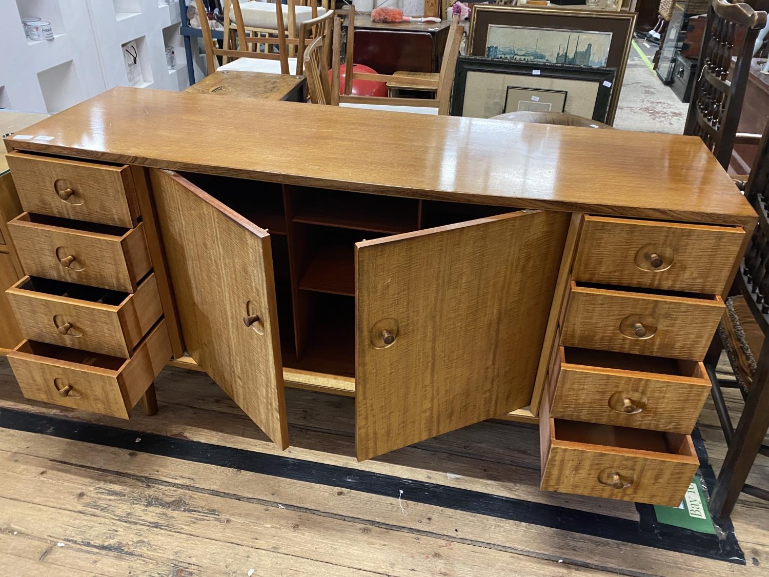 A mid century 1960's Gordon Russell sideboard with eight graduated drawers and central cupboard, - Image 2 of 7