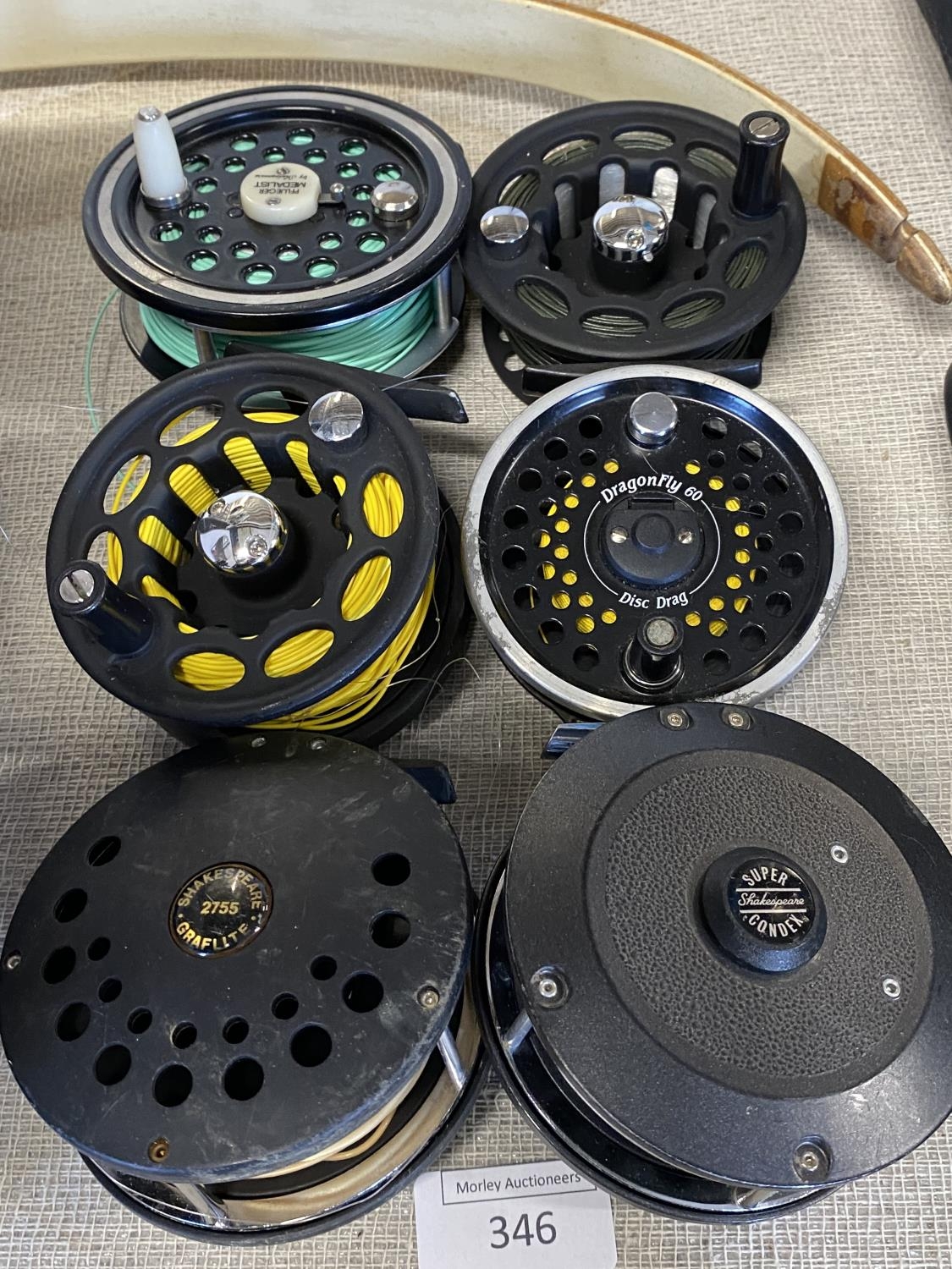 Six assorted fly fishing reels including Shakespeare