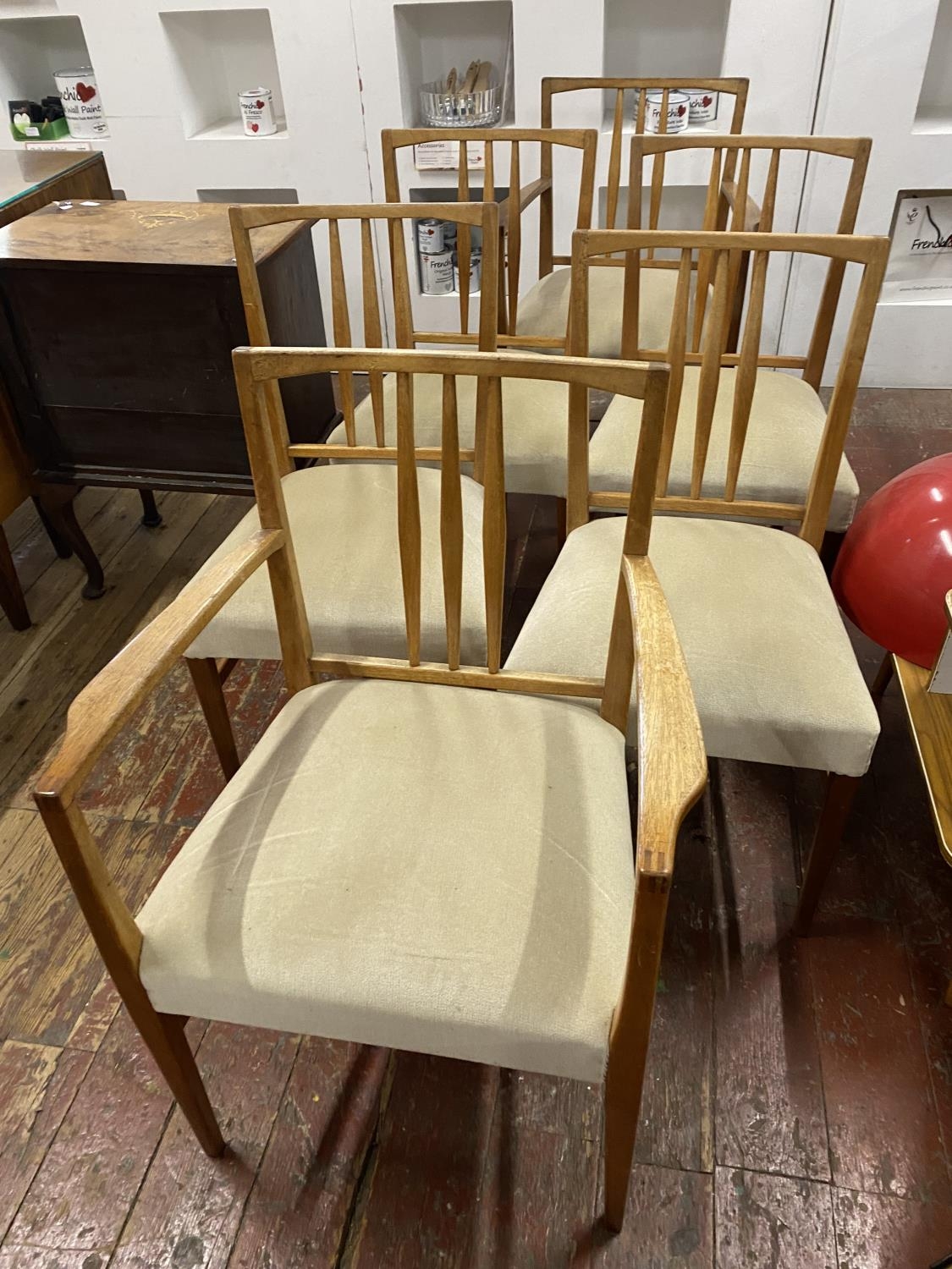 A set of six Gordon Russell dining chairs including two carvers. Shipping unavailable