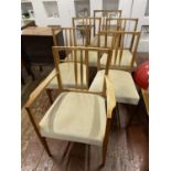 A set of six Gordon Russell dining chairs including two carvers. Shipping unavailable