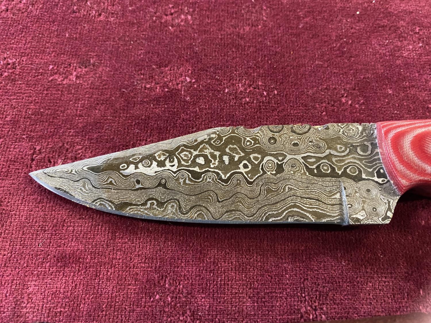 A hand forged Damascus steel bladed knife in leather sheath, over 18's only, UK post only - Image 3 of 3