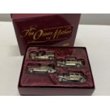 A limited edition boxed Lledo The Queen Mother Commemorative set of models in gold tone.
