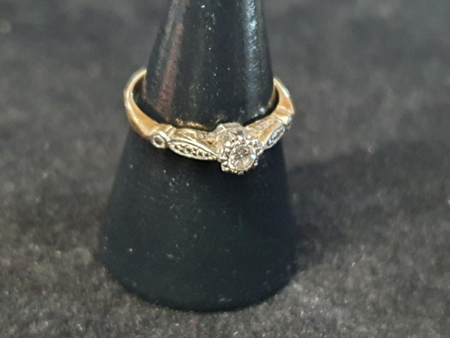 An antique 18ct Gold and platinum diamond solitaire ring. size M. 2.44g
