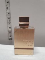 A bottle of Haramain amber oud gold edition