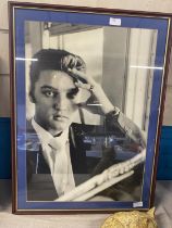 A framed print of Elvis Presley 75x55cm, shipping unavailable