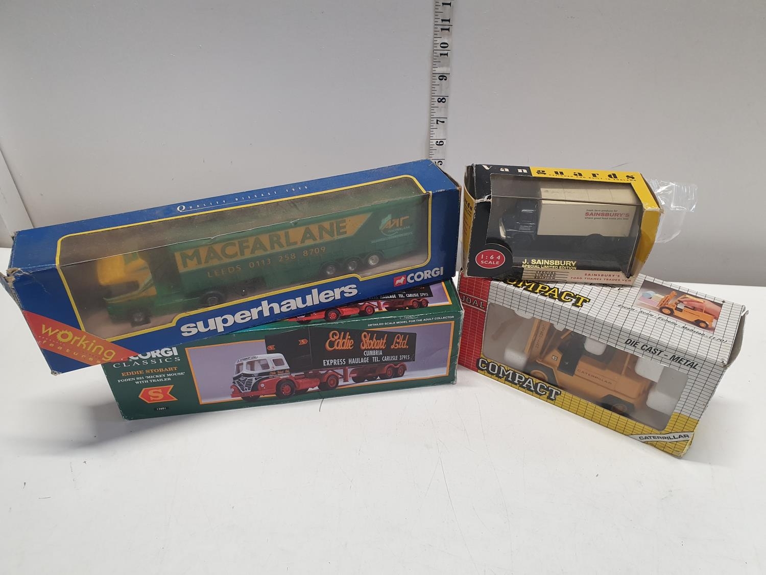 Four boxed die cast models including Corgi