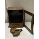 An antique oak smokers cabinet with internal pipe racks and glazed door with key. 30cm x 25 cm