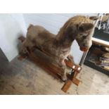 A vintage rocking horse on base. Shipping unavailable