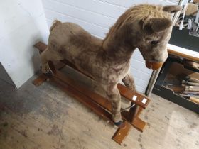A vintage rocking horse on base. Shipping unavailable