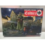 A boxed Colditz board game (unchecked)