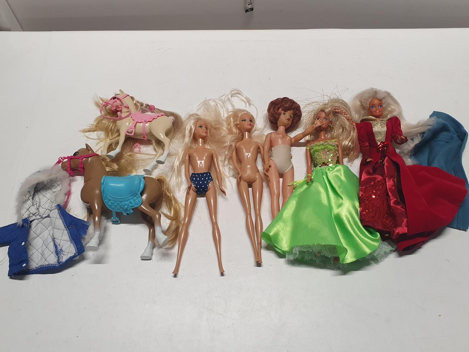 A selection of vintage dolls including Barbie and Cindy etc