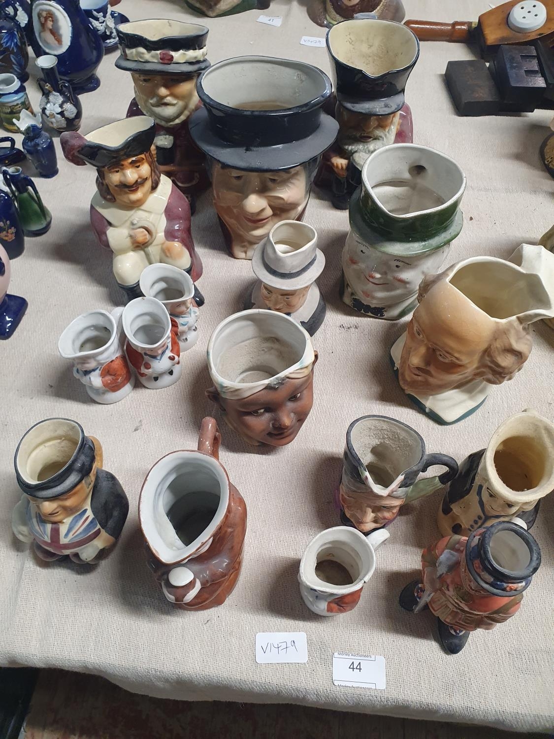 A large assortment of antique and vintage character jugs, shipping unavailable
