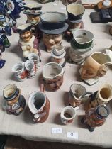 A large assortment of antique and vintage character jugs, shipping unavailable