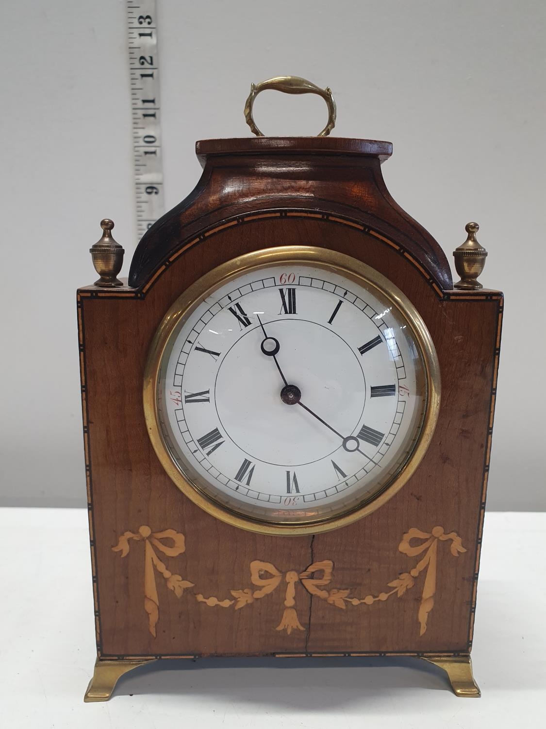 An antique Swiss made mantel clock with a makers mark of Fabrique d'Horlogerie de Fontainemelon