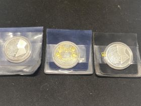 Three assorted collectable £5 proof coins