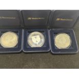 Three assorted collectable £5 proof coins