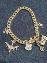 A 9ct gold bracelet with yellow metal charms. Gross weight 10.6g