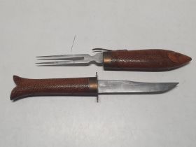 A carving set in the form of a fish