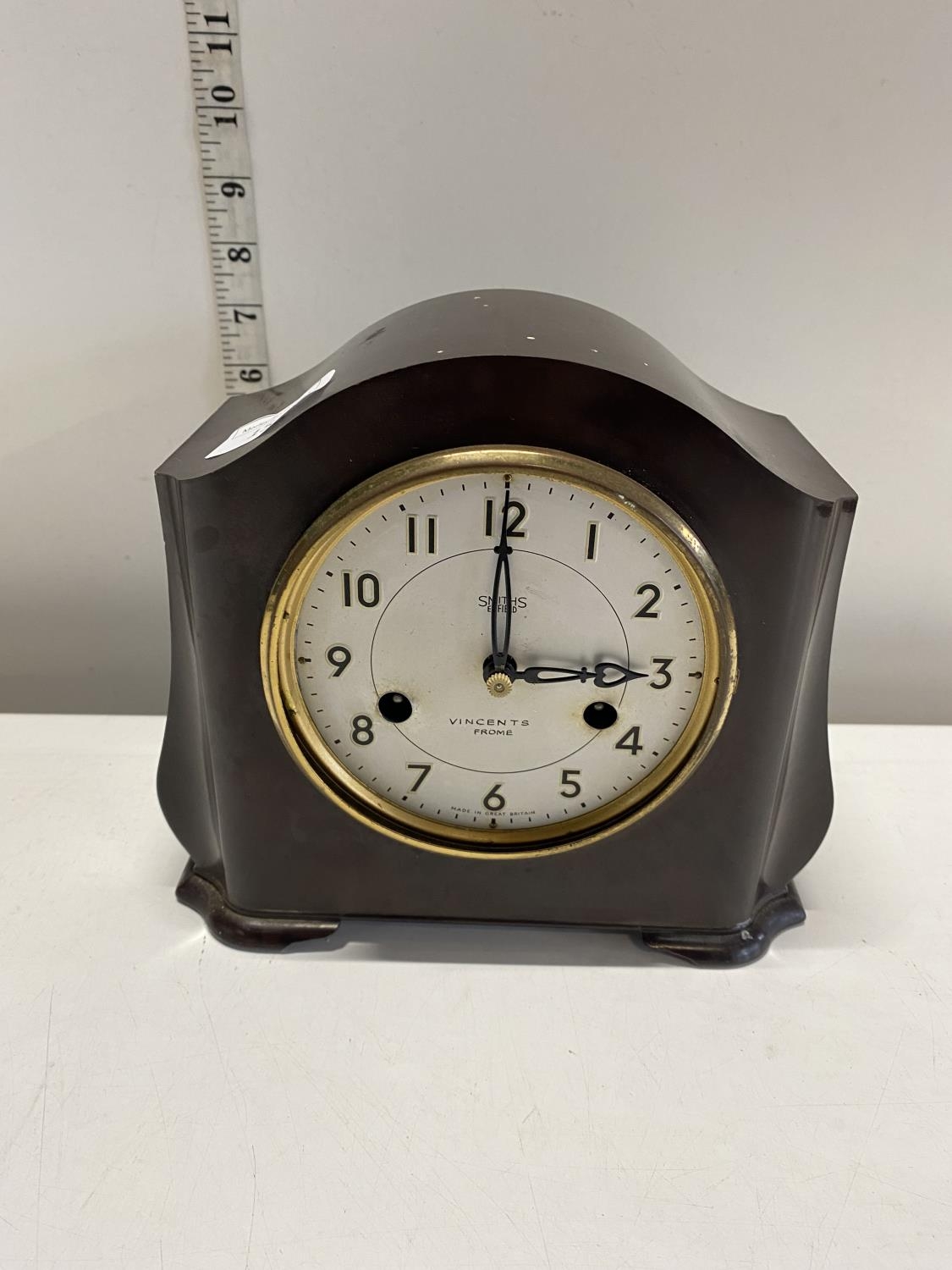 A vintage Bakelite mantle clock by Smiths Enfield with key and pendulum (missing glass), shipping