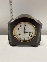 A vintage Bakelite mantle clock by Smiths Enfield with key and pendulum (missing glass), shipping