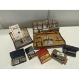 A assortment of vintage razors and other collectables