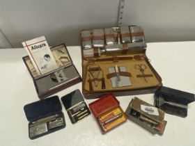 A assortment of vintage razors and other collectables