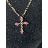 A 9ct gold chain and crucifix with red garnet decoration total weight 6.70g