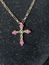 A 9ct gold chain and crucifix with red garnet decoration total weight 6.70g