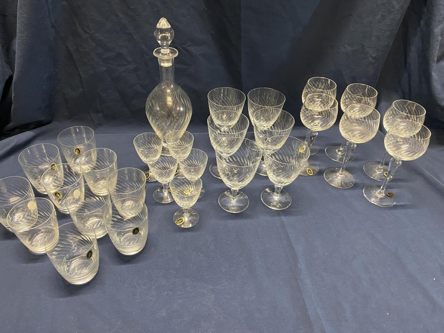 A large selection of handmade MCG etched glassware including decanter, wine glasses etc, shipping