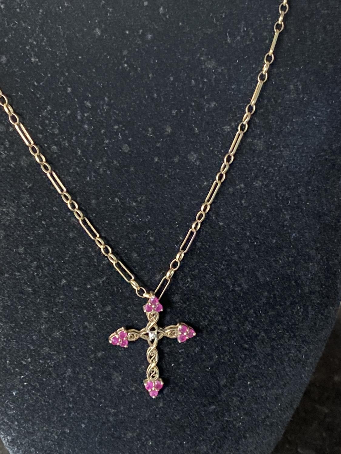 A 9ct gold chain and crucifix with red garnet decoration total weight 6.70g - Image 2 of 2
