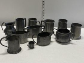 A selection pewter tankards, milk jugs etc