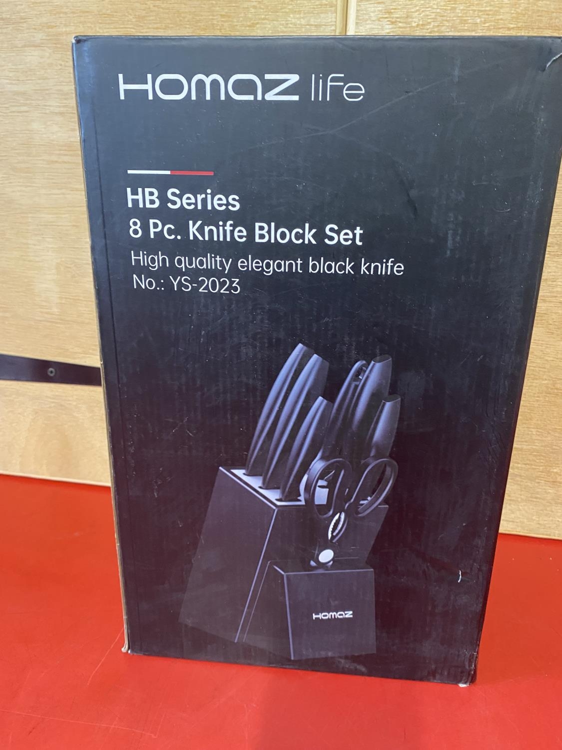 A Homaz eight piece knife block set, (UK post only)