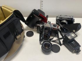 A vintage Praktica TL1000 and one other camera with accessories (untested),