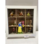 A display box with contents of Disney Snow White and the Seven Dwarfs figures