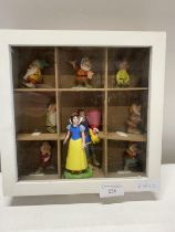 A display box with contents of Disney Snow White and the Seven Dwarfs figures