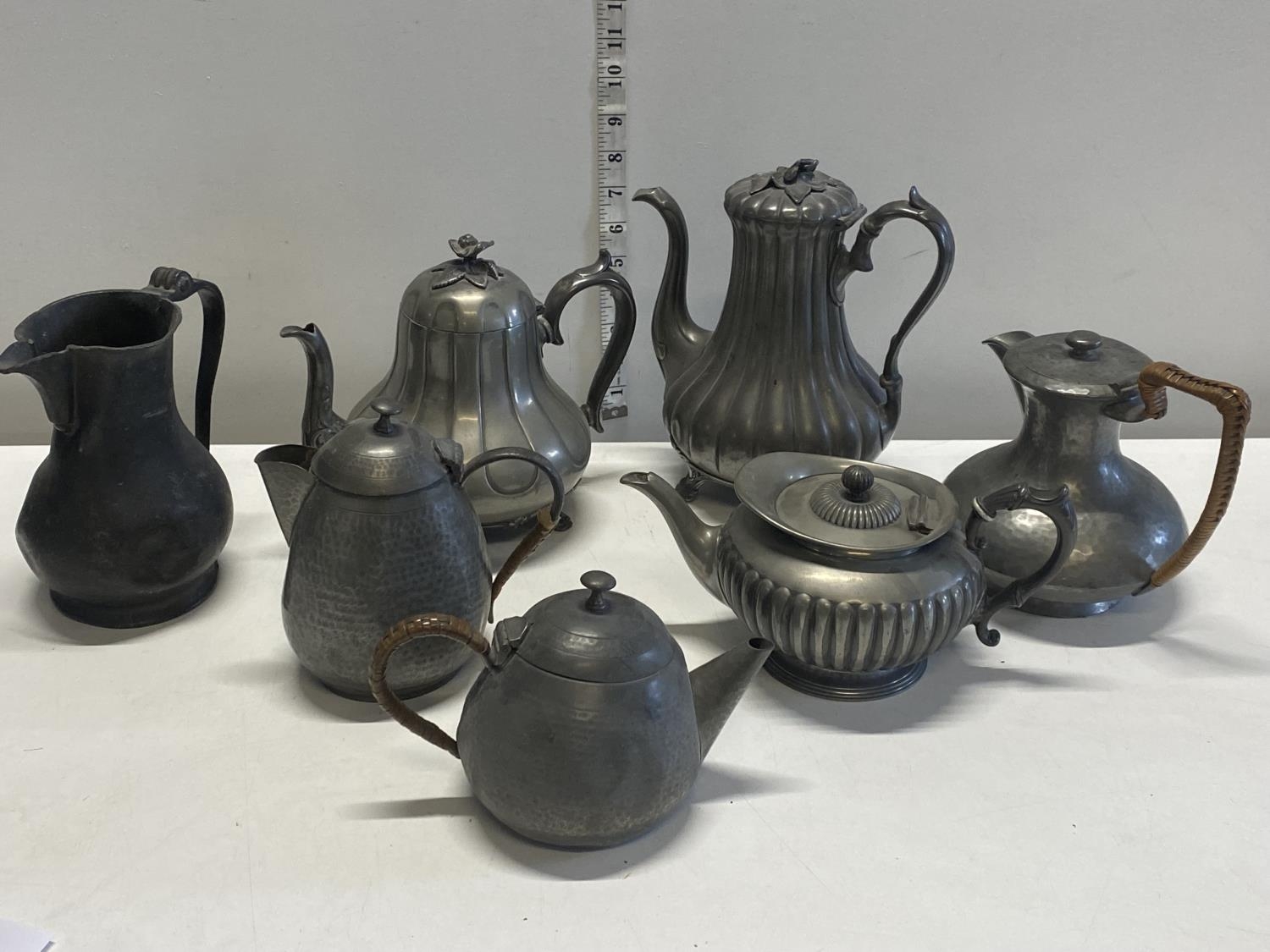 A job lot of pewter teapots