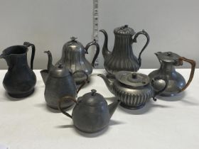 A job lot of pewter teapots