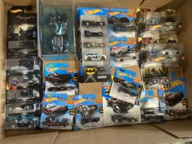 A job lot of boxed Hot Wheels die-cast models and figures