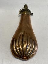A antique copper and brass powder flask marked by Batti