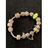 A silver Pandora bracelet with charms gross weight 59g